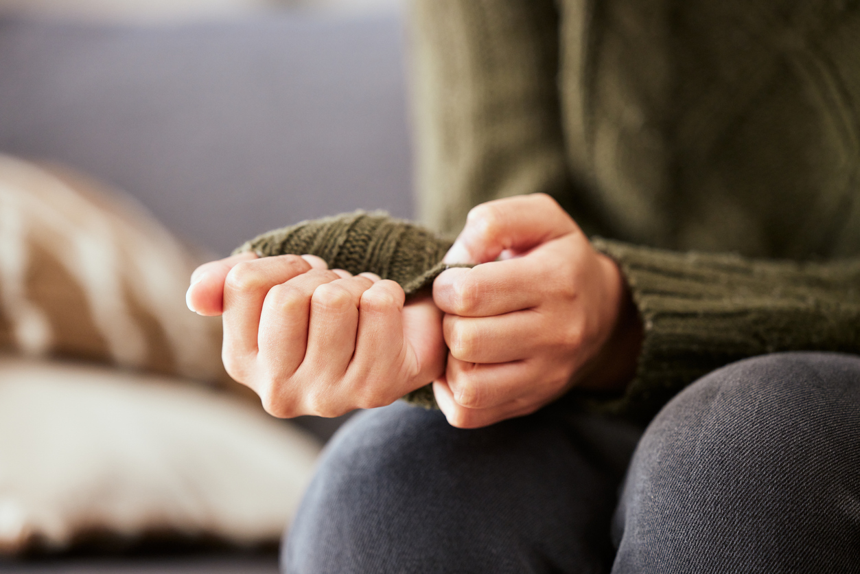 Shot of a unrecognizable woman sitting on a sofa and feeling anxious medicinal mushrooms for anxiety
